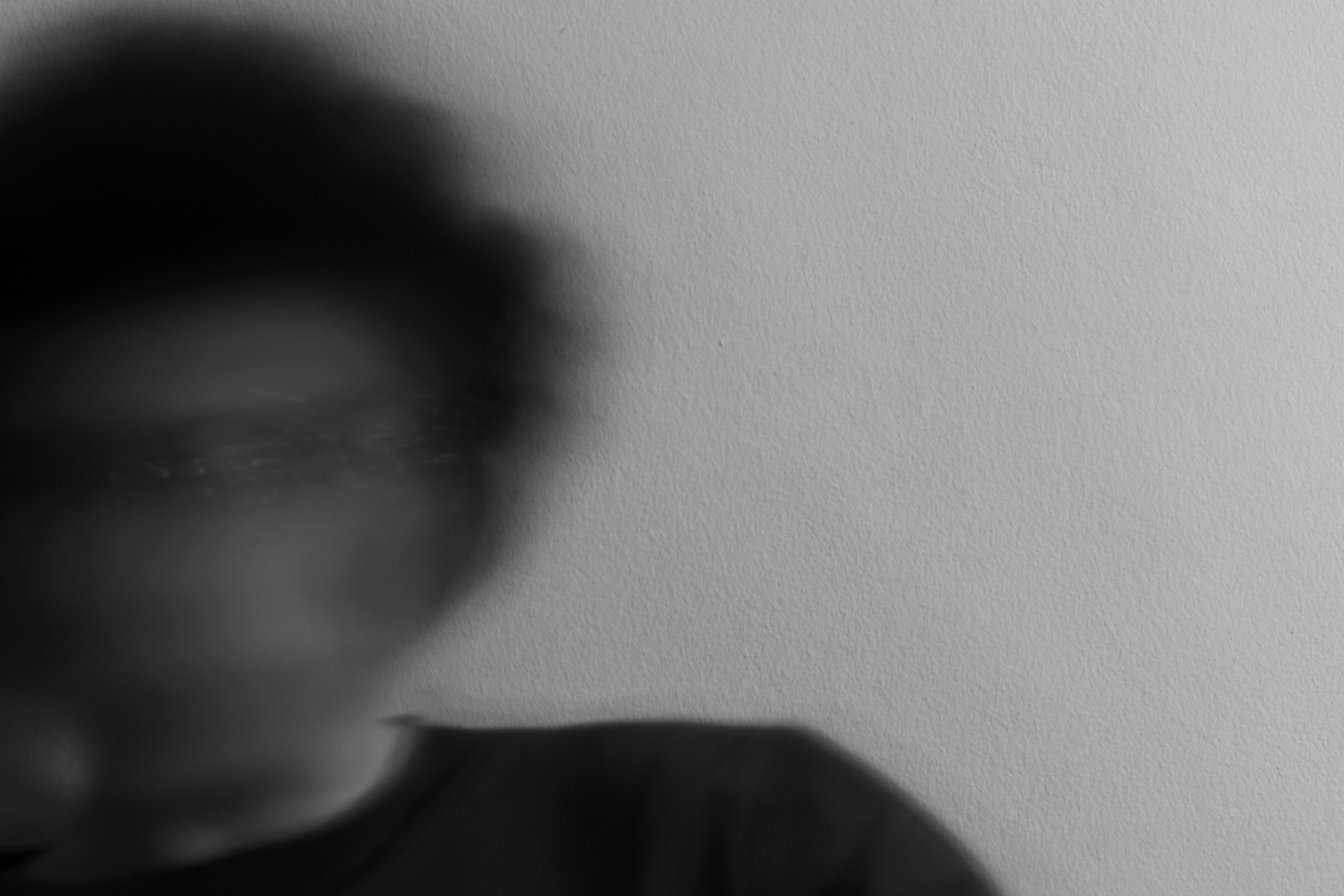grayscale photo of man in crew neck shirt